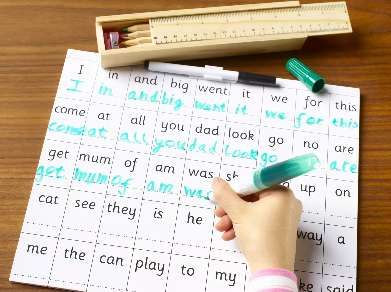 Child practicing handwriting and spelling